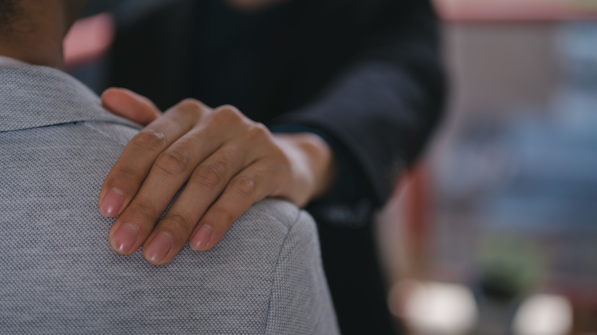 businessman put hand on friend shoulder gives encouragement in support concept. valentines day concept, giving love to all. consultation about mental health life problems